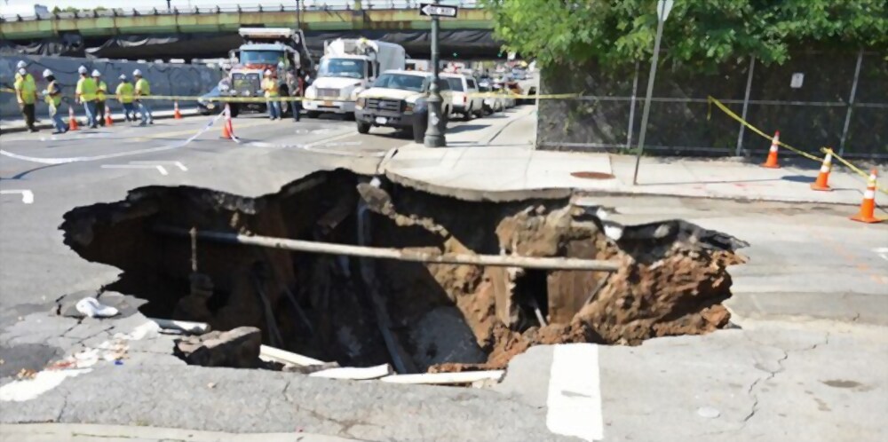 Sinkhole in Sidewalk